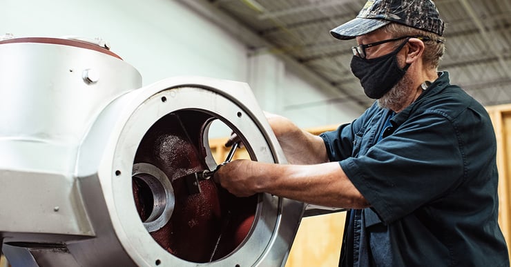 separators employee fixing a centrifuge