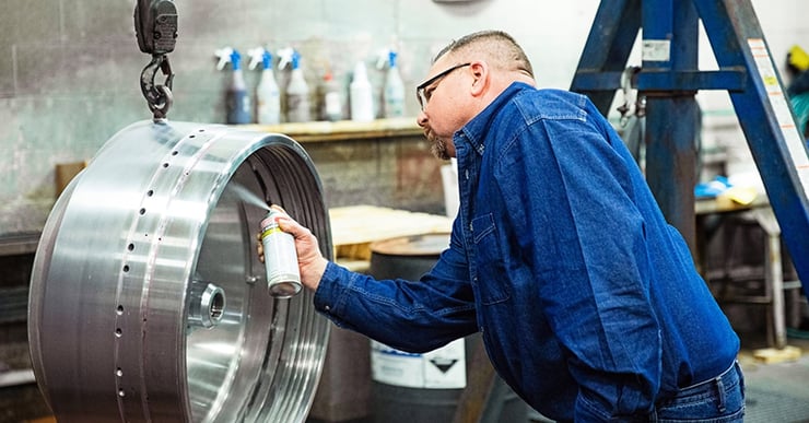 Man works on centrifuge bowl