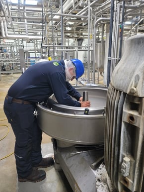 Technician servicing a centrifuge.