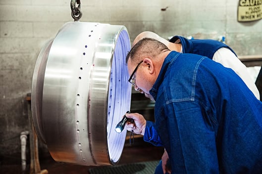 centrifuge part being inspected for maintenance