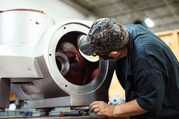 separators employee doing maintenance on a centrifuge