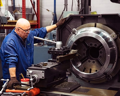 Separators employee working on machinery