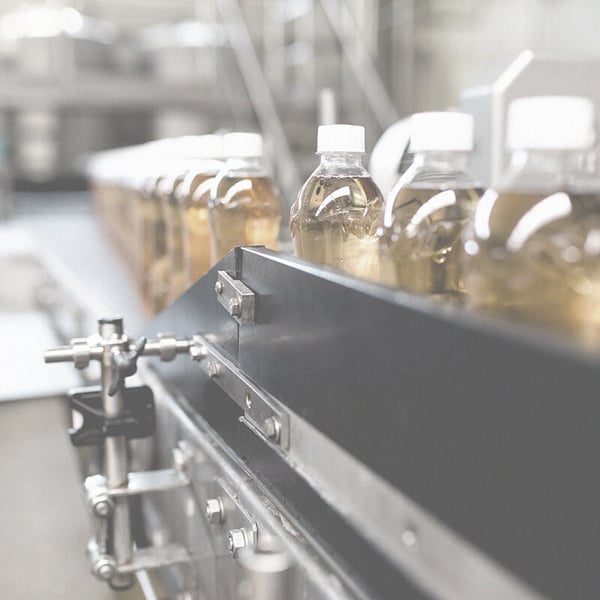 Juice bottles on conveyor belt