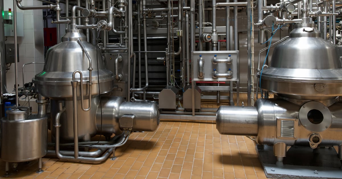 centrifuges sit on plant floor side by side.