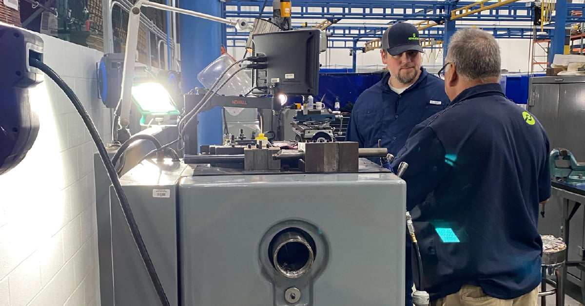 Technicians working with a centrifuge.