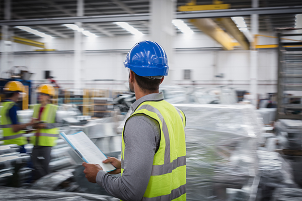 Image of a man working in a plant.